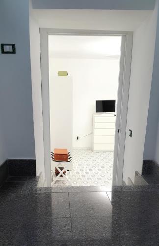 an open door to a room with a suitcase at La casetta di Tano in Morano Calabro