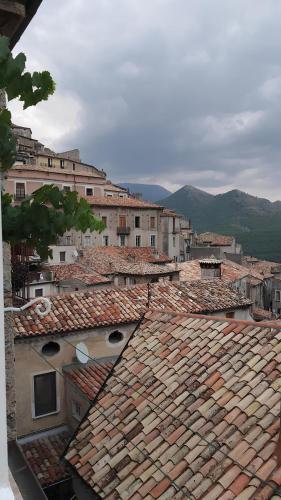 a view of roofs of a city with buildings at La casetta di Tano in Morano Calabro