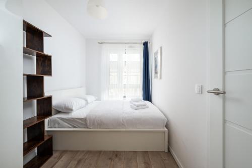 Säng eller sängar i ett rum på Matisse Cosy Apartment