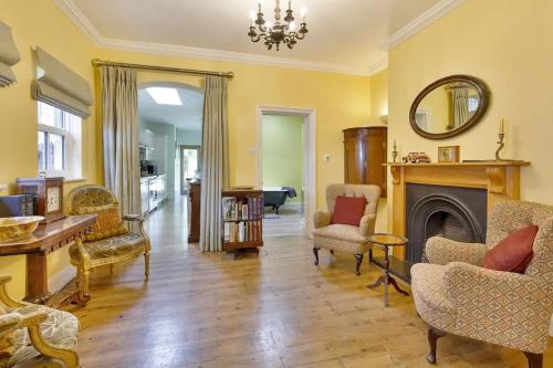 a living room filled with furniture and a fireplace at Windsor/Legoland/Ascot charming 3BR home in centre in Windsor