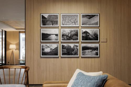 a group of pictures hanging on a wall at Fairfield by Marriott Okayama Tsuyama in Tuyama