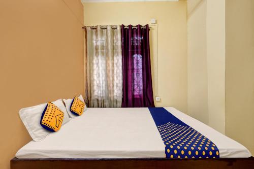 SPOT ON Hotel Babilon tesisinde bir odada yatak veya yataklar