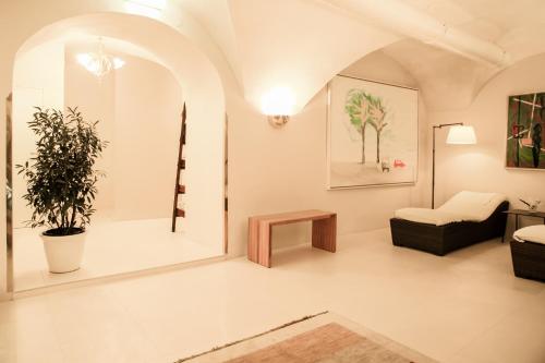a living room with a couch and a table at Schlossberghotel in Graz