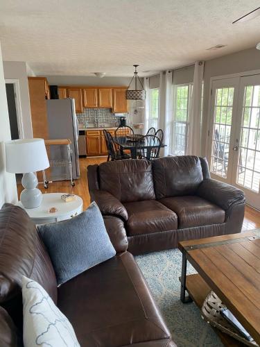 a living room with a couch and a table at House #16 - Weiss Decision - (No pets) Lake View in Centre