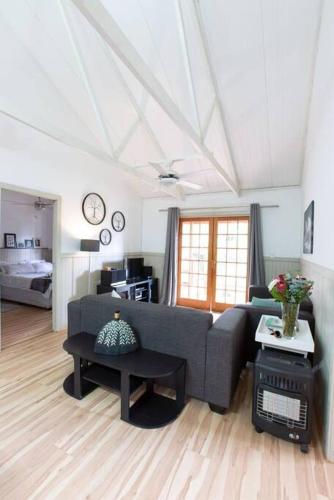 a living room with a couch and a table at Lala Lapa Self Catering Accomodation in Nelspruit