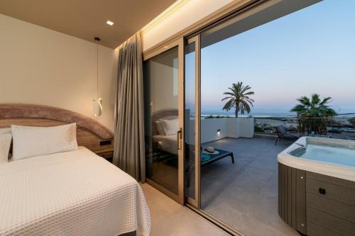 Ένα ή περισσότερα κρεβάτια σε δωμάτιο στο Cove Luxury Suites