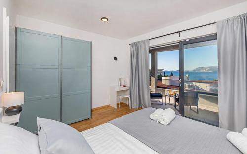 a bedroom with two beds and a view of the ocean at Villa Bellevue in Cavtat