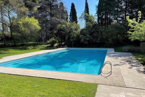 a swimming pool in the yard of a house at 06V - Beautiful villa with spa pool and tennis in Biot