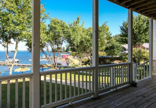 a view of the water from the porch of a house at House #44 Dock Holiday (no pets) Lakefront Private Boatslip in Centre