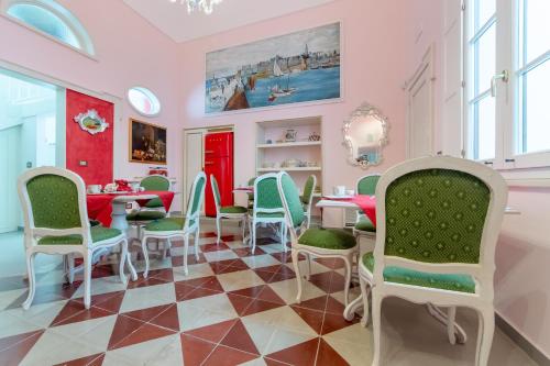 a dining room with a table and chairs at The Crown Palace - Gallipoli in Gallipoli