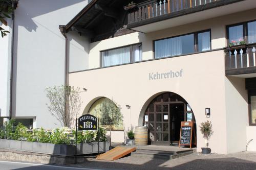 a building with the entrance to a restaurant at Kehrerhof in Rifiano