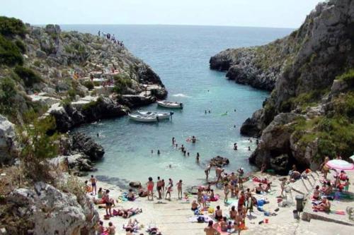 a group of people on a beach in the water at LA PERLA, comfort e relax in Vignacastrisi