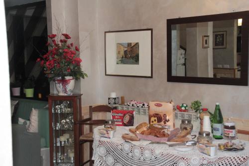 a table with a table cloth with food on it at Villa Axa in Casal Palocco