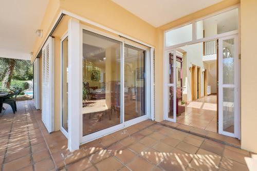an empty house with sliding glass doors on a patio at Villa Franci - Blanes in Blanes