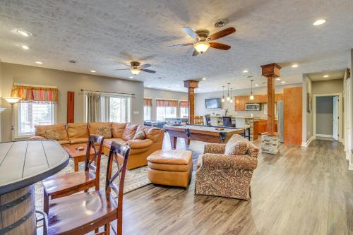 a living room with couches and a table at Large Tazewell Home Less Than 1 Mi to Norris Lake Access! in Tazewell