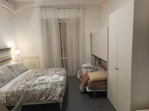 Un ou plusieurs lits dans un hébergement de l'établissement B&B La Piccola Stella