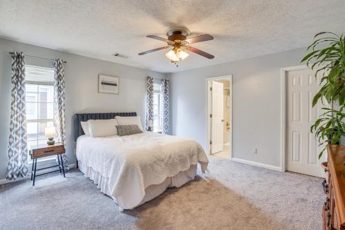 a bedroom with a bed and a ceiling fan at Pet-Friendly Millbrook Home with Covered Patio! in Millbrook