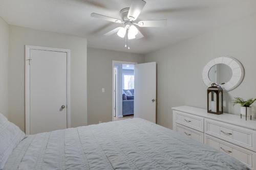 a white bedroom with a bed and a ceiling fan at Celina Home about 1 Mi to Marina Boat, Fish and More! in Celina
