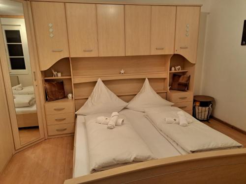 a bedroom with a bed with two towels on it at Bergkuss Brunnalm Veitsch in Veitsch
