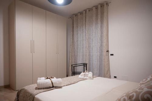 Ένα ή περισσότερα κρεβάτια σε δωμάτιο στο Casa Madoro