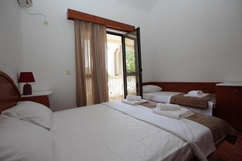 Katil atau katil-katil dalam bilik di Magnolia rooms and apartments