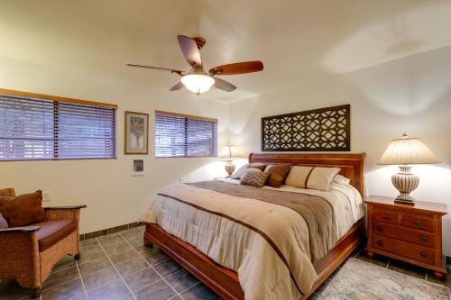 a bedroom with a bed and a ceiling fan at Williams Cottage with Patios and Grill Near Route 66 in Williams