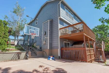 a house with a basketball hoop in front of it at Whistler Hollow! Family Home, Bball Court, Firepit in Colorado Springs