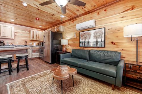 a living room with a couch and a kitchen at Best Court in Hot Springs