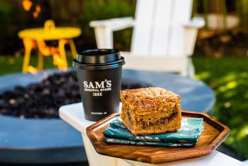a piece of cake and a cup of coffee on a table at Brannan Cottage Inn in Calistoga