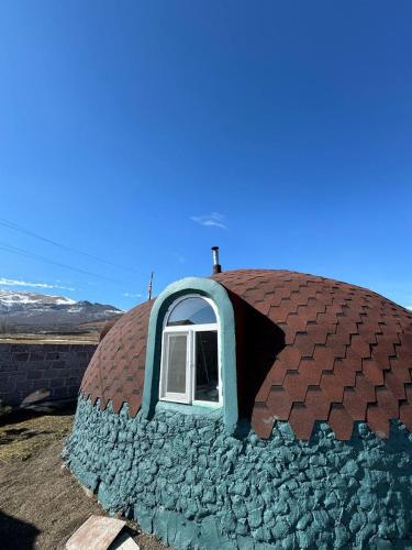 a dome shaped house with a window in it at In bookhari in Pushkino