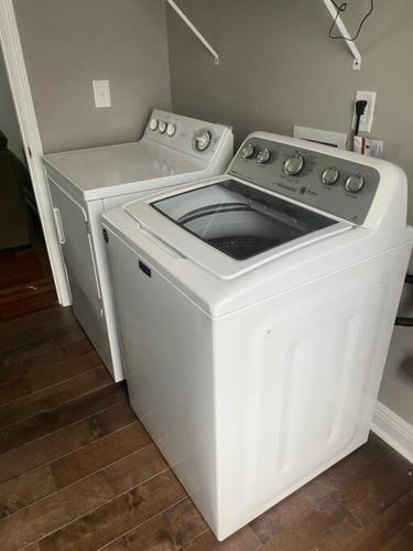 a white washer and dryer in a room at Huntersville House 3 bedrooms 2 Baths in Huntersville