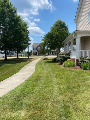 a house with a driveway in a residential neighborhood at Davidson House - 3 beds 2.5 baths in Davidson