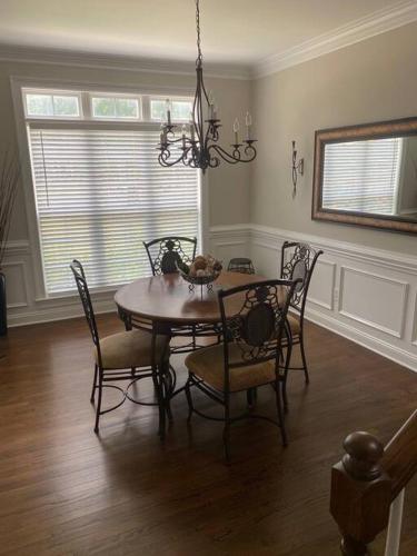 a dining room with a table and chairs at Davidson House - 3 beds 2.5 baths in Davidson
