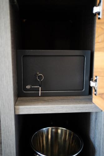 a sink in a cabinet with a metal bowl at Duomo Guest House in Barletta