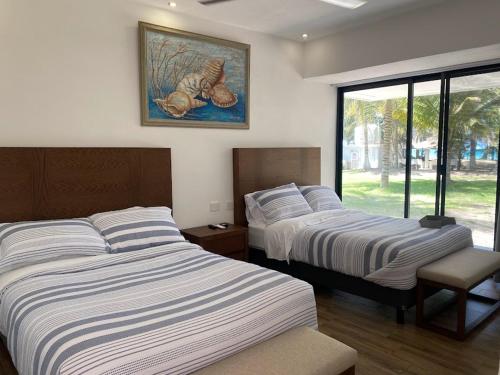 מיטה או מיטות בחדר ב-Villas del Mar