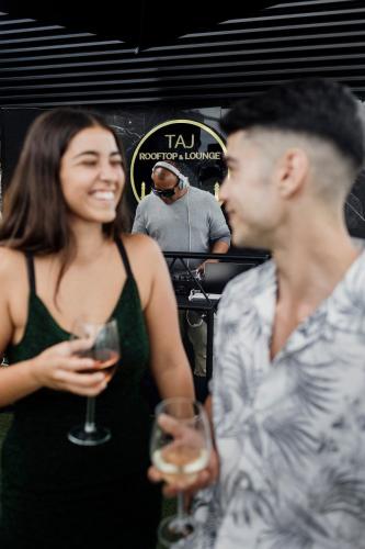 a man and a woman holding wine glasses at Silken Saaj Las Palmas in Las Palmas de Gran Canaria