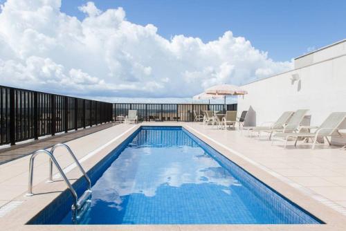 a swimming pool on top of a building at Monumental Nobile- Apart hotel Central in Brasilia