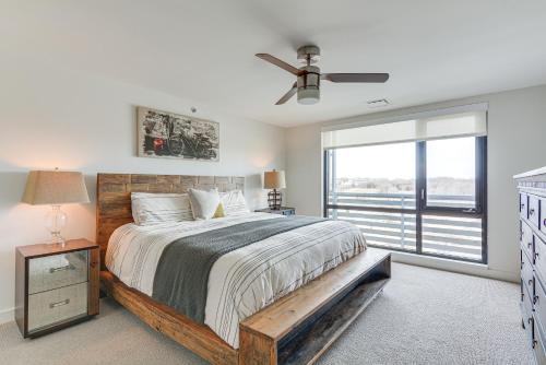 a bedroom with a large bed and a window at Modern Springfield Apartment about 7 Mi to Downtown! in Springfield