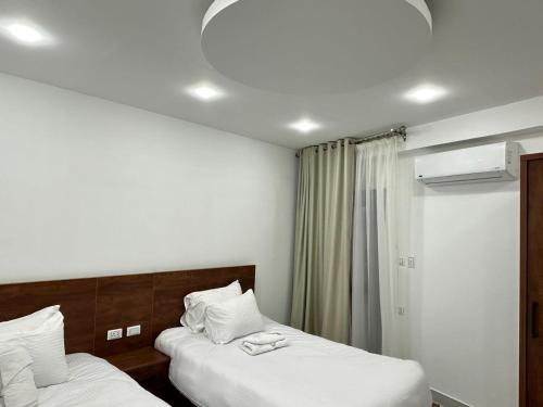 Ein Bett oder Betten in einem Zimmer der Unterkunft Prince Pyramids Inn