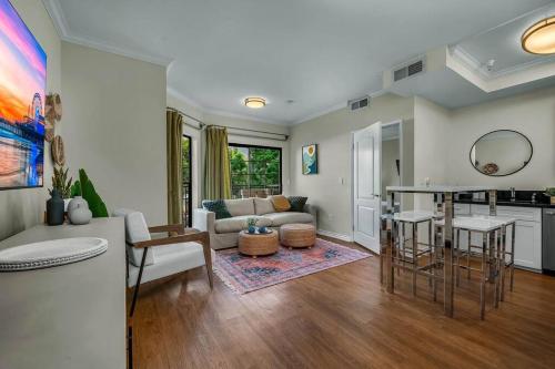 a living room with a couch and a table at Stylish in Sunny Santa Monica walk to Beach & Pier in Los Angeles