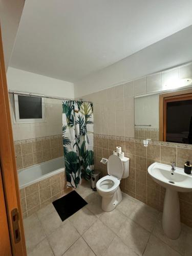 a bathroom with a toilet and a sink at Sesta Home Cyprus in Kalecik