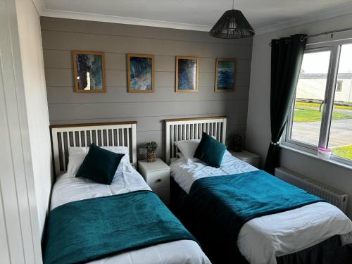 Katil atau katil-katil dalam bilik di Inviting 6 Birth Lodge - Southview Skegness