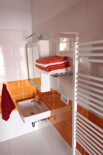 a bathroom with a sink and a mirror at Apartmány Malý Princ in Bojnice