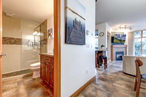 a bathroom with a tub and a toilet and a sink at Central 2BR with Prime Amenities in Whistler
