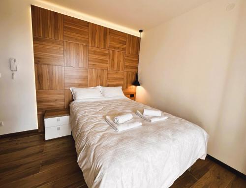 Postel nebo postele na pokoji v ubytování Beli Lotus apartman Borovi