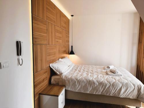 Postel nebo postele na pokoji v ubytování Beli Lotus apartman Borovi