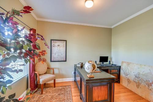 a living room with a desk and a chair at Spacious Phenix City Home about 9 Mi to Columbus! in Phenix City