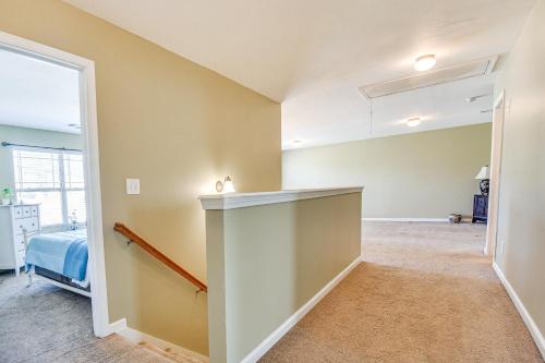 a room with a hallway with a bed and a window at Spacious Phenix City Home about 9 Mi to Columbus! in Phenix City