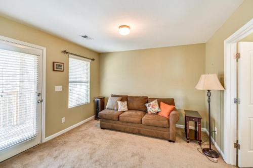 a living room with a couch and a window at Spacious Phenix City Home about 9 Mi to Columbus! in Phenix City
