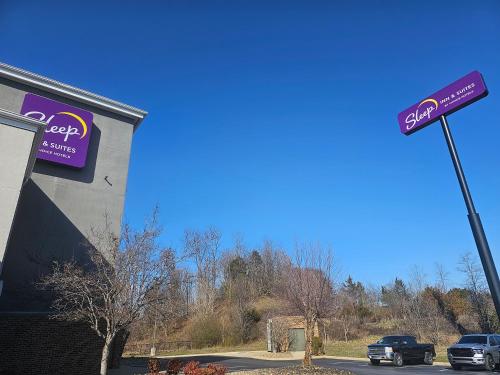 a store with a sign on the side of a building at Sleep Inn & Suites Kingsport TriCities Airport in Kingsport